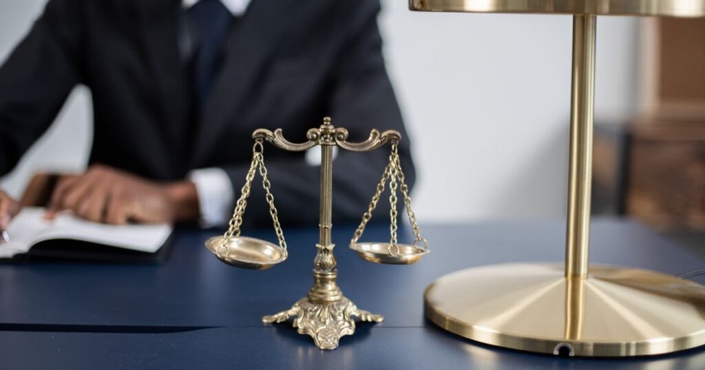 Scales of justice on a solicitor's desk, representing a criminal injuries compensation CICA claim